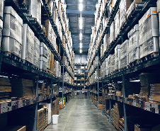 Interior of a large warehouse with high shelving